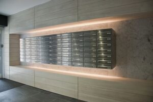 Modern wall-mounted mailbox units in a well-lit lobby.
