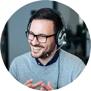 Smiling man with headset working.